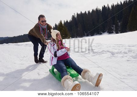 romantic winter  scene, happy young couple having fun on fresh show on winter vacatio, mountain nature landscape