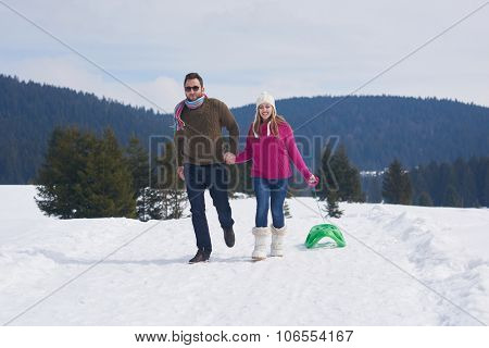 romantic winter  scene, happy young couple having fun on fresh show on winter vacatio, mountain nature landscape