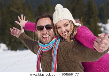 portrait of happy young romantic tourist  couple outdoor in nature at winter vacation