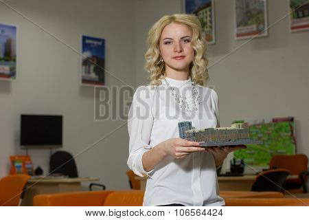 Girl Real Estate Agent Holding A Model Home
