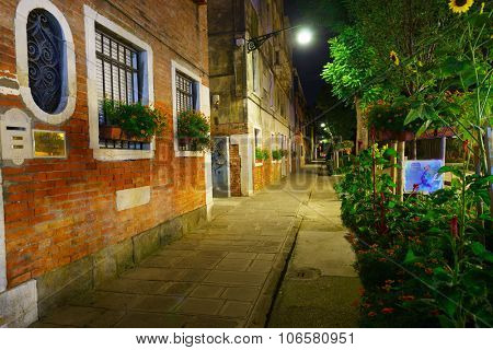 VENICE, ITALY - SEPTEMBER 14, 2014: Venice at night. Venice is a city in northeastern Italy sited on a group of 118 small islands separated by canals and linked by bridges
