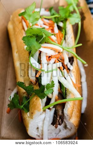 Bahn Mi Sandwich In Cardboard Container
