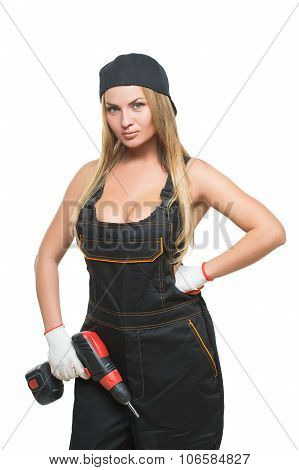 Young sexy female holding a cordless screwdriver