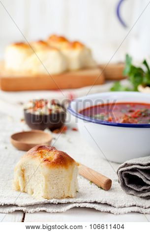 Traditional Ukrainian Russian vegetable soup, borsch with garlic donuts, pampushki.