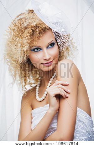 Fashionable woman with bright blue makeup