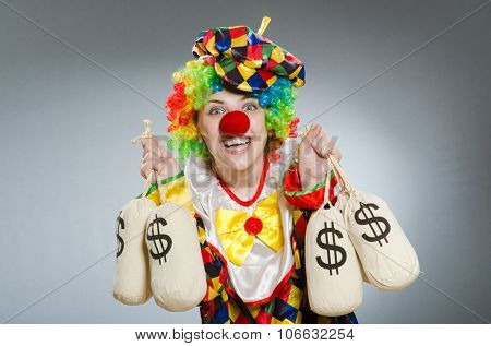 Clown with money bag in funny concept