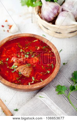 Traditional Ukrainian Russian vegetable soup, borsch with garlic donuts, pampushki .