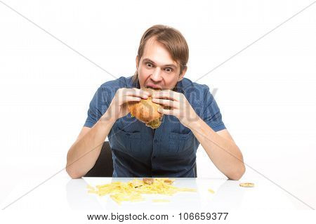 man is not careful eating tasteless burger.
