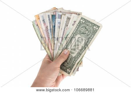 Fan of banknotes of various countries in the hand