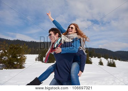 romantic winter  scene, happy young couple having fun on fresh show on winter vacatio, mountain nature landscape