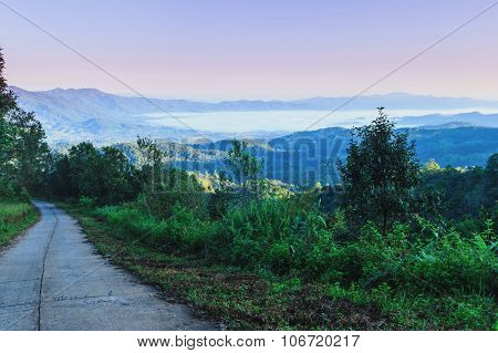 Misty morning sunrise in mountain in Wiang Haeng ,Chiang Mai , Thailand.