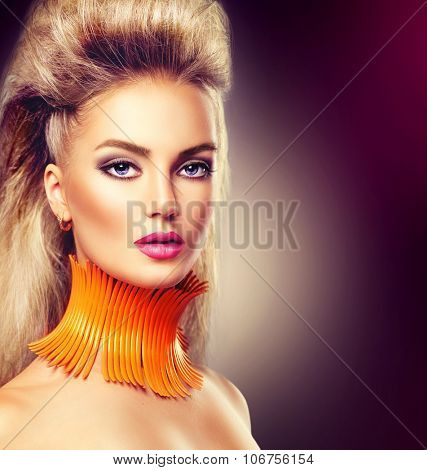High Fashion Model Girl with Mohawk hairstyle and vivid make up. Beauty woman with glamour updo hair style