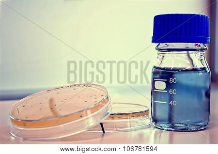 Petri Dishes And A Bottle