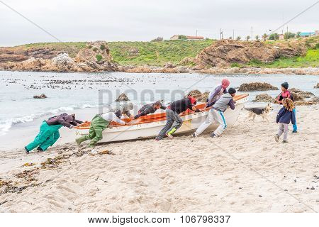 Fishermen Moves Their Boat To Above The High Water Mark