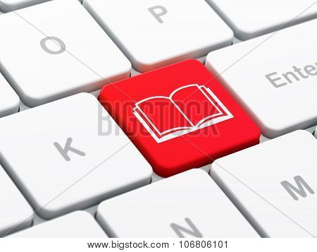 Science concept: Book on computer keyboard background