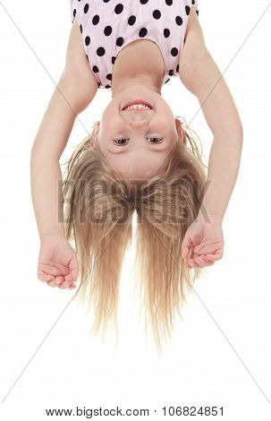A Little with head upside down in studio