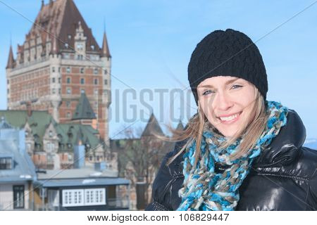 Beautiful woman on the blue sky of Quebec winter