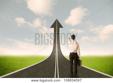Businessman lokking at 3d road upgoing arrow concept