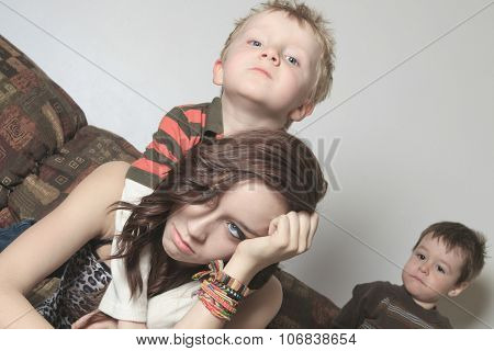 A teenager having Hard Time in the living room.