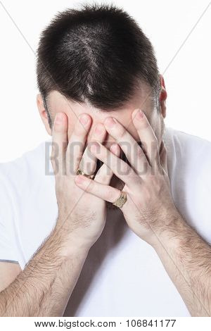 A man having a disturbing problem over white