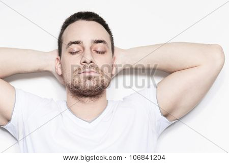 A relax man over a studio white background