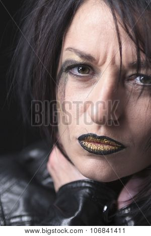 A gothic woman over a dark background,