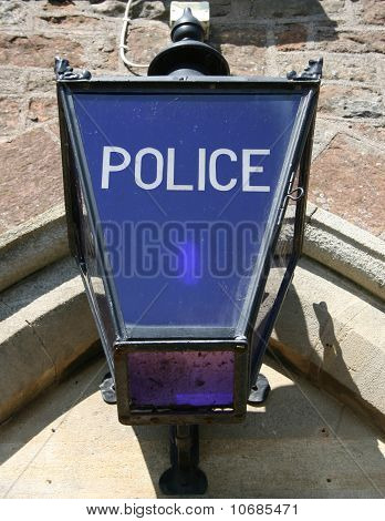 Старомодный полиции лампа с голубой стекло