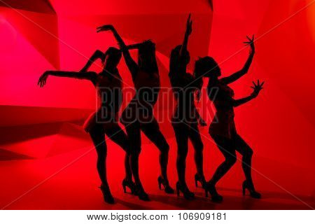 Silhouettes Of Four Slim Dancing Girls