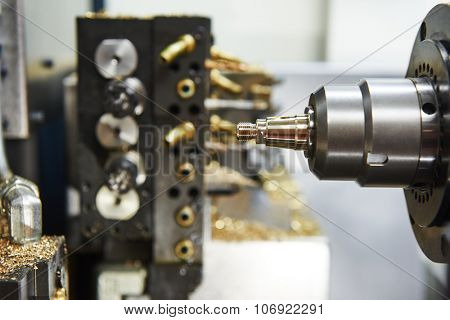 Metalworking industry. close-up view of brass detail during cutting process on moderm machining center 