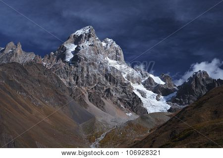 Mountain landscape with the top of Ushba. A sunny autumn day. Main Caucasian ridge. Zemo Svaneti, Georgia 