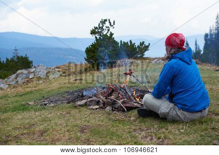 advanture man with backpack hiking on mountain forest