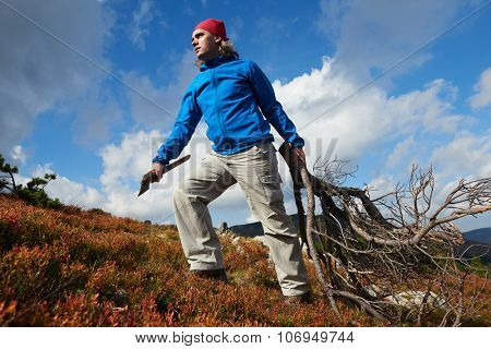 advanture man with backpack hiking on mountain forest