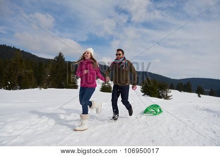romantic winter  scene, happy young couple having fun on fresh show on winter vacatio, mountain nature landscape