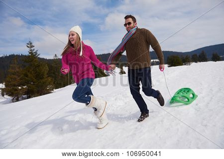 romantic winter  scene, happy young couple having fun on fresh show on winter vacatio, mountain nature landscape