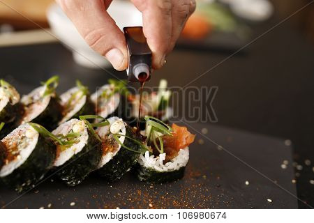 Classic thick rolls futomaki served on a stone plate