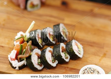 Sushi master preparing sushi in Japanese restaurant