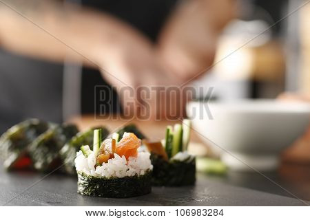 Classic thick rolls futomaki served on a stone plate