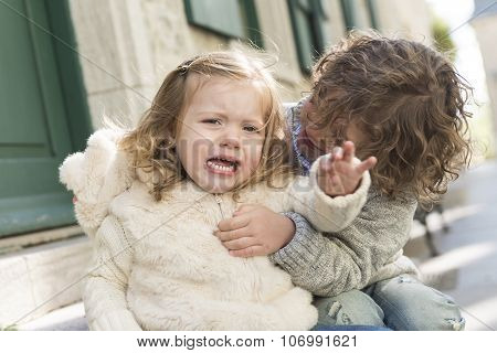 Brother consoling his sister