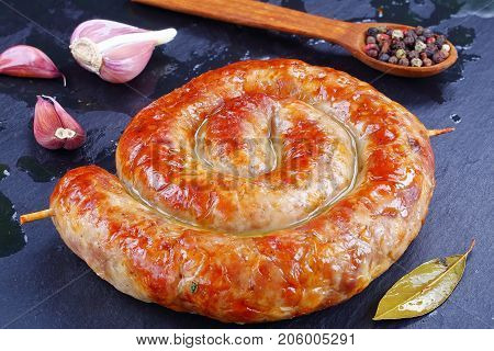 Round Fried Spiral Sausages On Slate