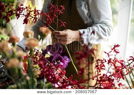 Flowerist working in the flower shop vintage style