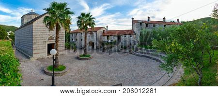 BUDVA MONTENEGRO - SEPTEMBER 7 2017: Monastery Podmaine (Podostrog) Assumption Church Budva Montenegro. Unknown people are on territory of monastery