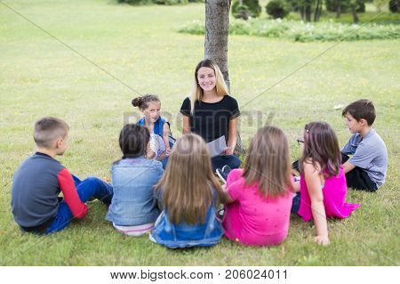 The Great Portrait Of School Pupil Outside Classroom Carrying Bags