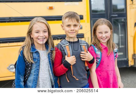 The Great Portrait Of School Pupil Outside Classroom Carrying Bags