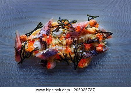 Smoked sardines salad with creamy cheese corn codium and hazelnuts