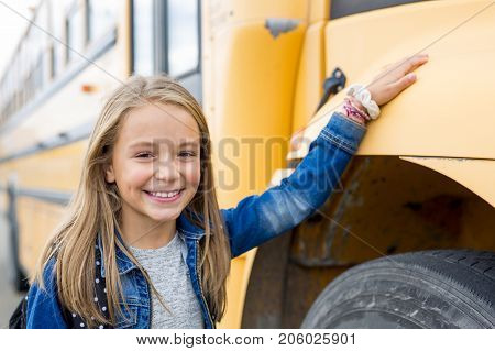 The Great Portrait Of School Pupil Outside Classroom Carrying Bags
