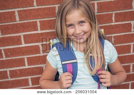 A nine years old girl student at school