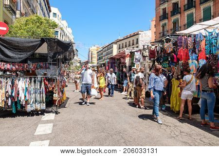 MADRID,SPAIN - AUGUST 6,2017 : People shopping at El Rastro, the most popular open air market in Madrid