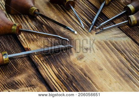 Different Gravers For Jewelry On Wooden Background