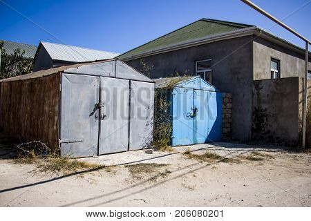 Old prefabricated metal doors of metal garage