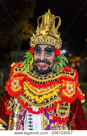 Ubud, Indonesia - August 8, 2016: Portrait of the balinese artist as an evil King Ravana in traditional Kecak Fire Dance ceremony in Hindu temple on Bali, Indonesia